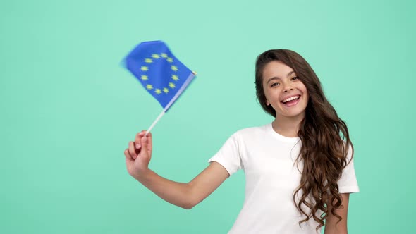 Happy Child Waving European Union Flag on Blue Background Showing Thumb Up Patriot