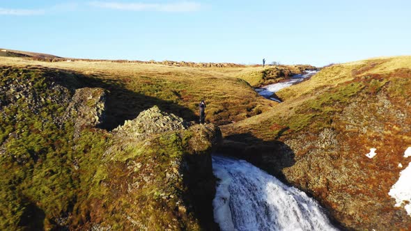 Aerial Panoramic View of a Fast Flowing Waterfall in Iceland alt