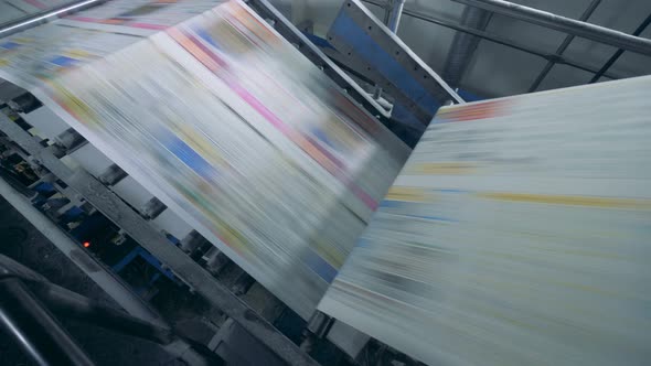 Printed Paper Is Rolling Through the Printing Machine. Fake News Concept. alt
