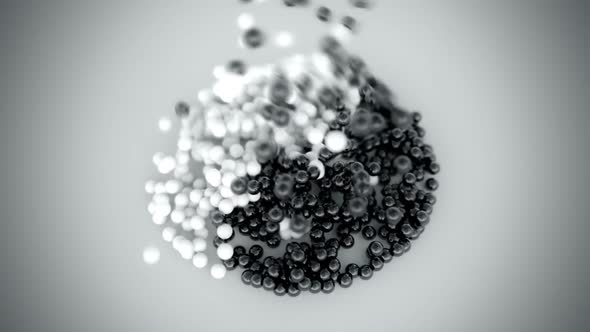 Falling black and white pebbles forming the perfect Yin-yang symbol. HD alt