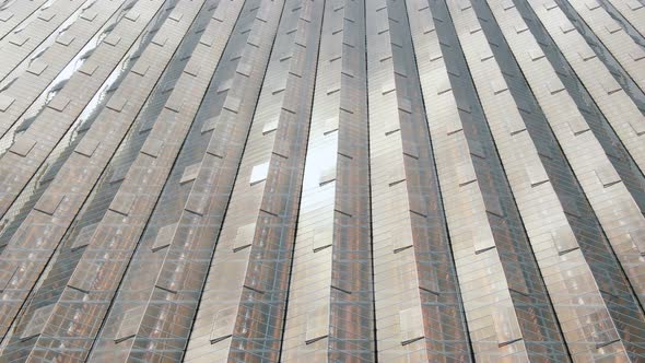 Greenhouse Buildings with Growing Plants Under Glass Roofs alt