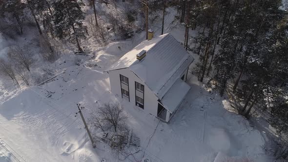 Aerial view of new white modern residential house at winter near the forest 17 alt