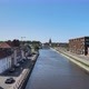 Calais, northern France. Aerial, Flying low above the canal with view on city center - VideoHive Item for Sale