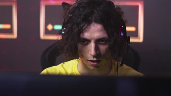 Concentrated Male Gamer Playing Video Game alt