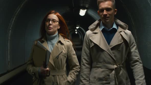 Two people going through the tunnel alt