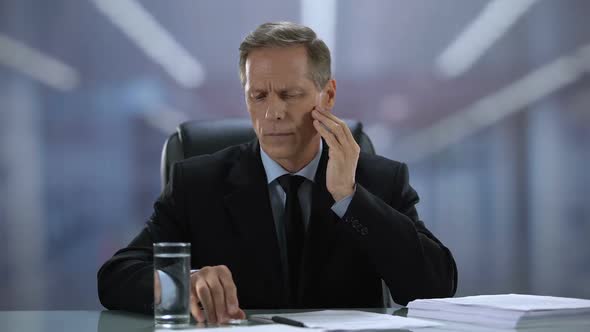 Tired Business Person Suffering Migraine Reading Document Taking Painkiller Ache alt