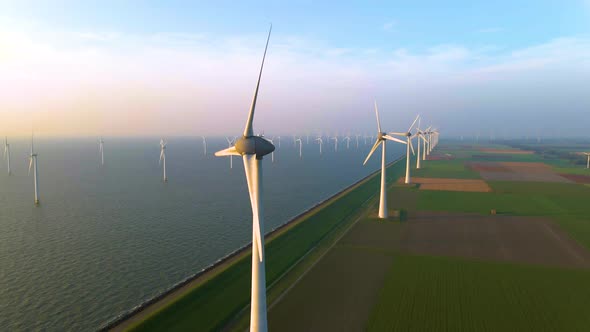 Wind Turbines in the Early Morning Wind Mill Park in the Netherlands alt