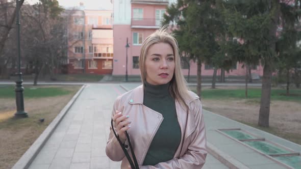 The Young Girl is Scared and Runs Away in the City alt