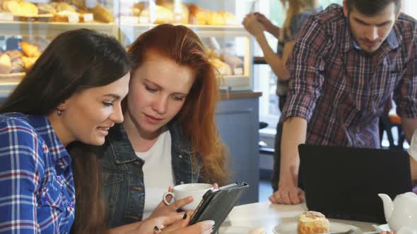 Group of Young Friends Having Breakfast Together Using Gadgets alt