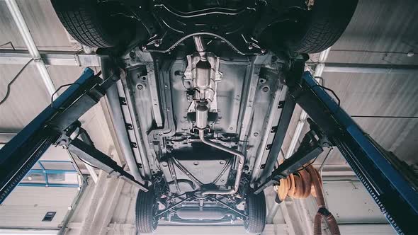 View under the car at the service station alt