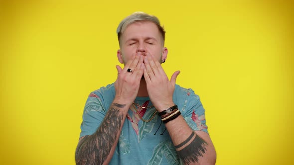 Smiling Romantic Man Sending Lots of Air Kisses Looking at Camera and Smiling Missing you Love alt