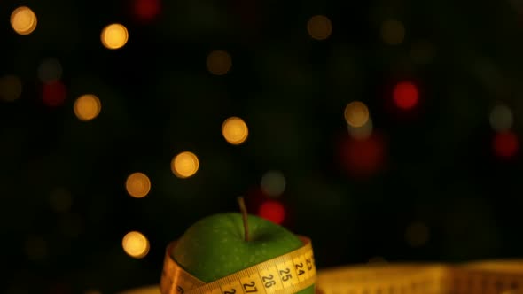 Apple wrapped in measuring tape alt