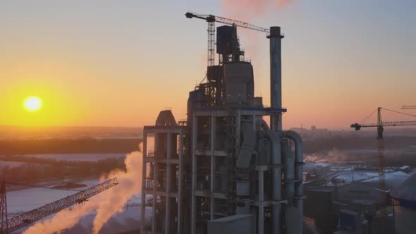 Aerial View of Cement Factory Tower with High Concrete Plant Structure at Industrial Production Area alt