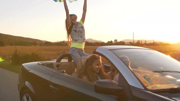 Women Having a Fun in a Convertible Car by Ilya2k | VideoHive