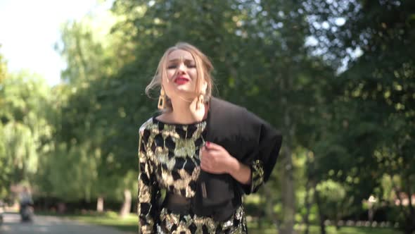 Aggressive Drunk Young Woman Talking Arguing Looking at Camera Standing in Sunshine Staggering alt