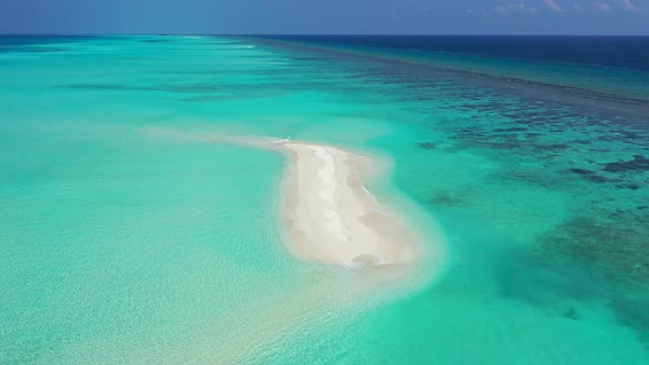 Beautiful drone clean view of a sandy white paradise beach and blue ocean background in hi res 4K alt
