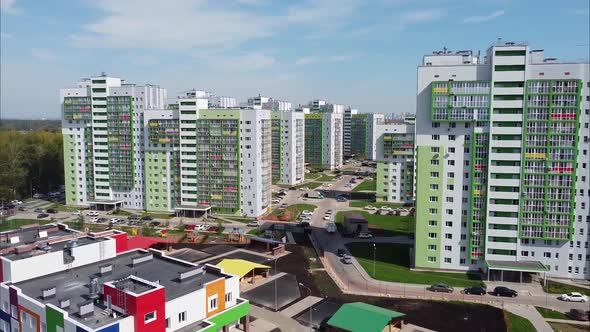 View of Modern Apartment Buildings and a Kindergarten with Bright Colorful Facades From a Bird's Eye alt