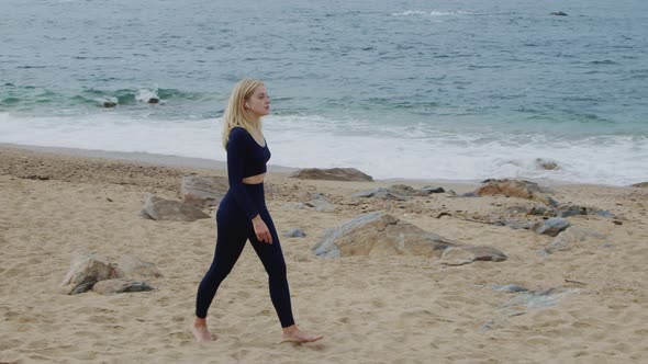 Fit Woman Is Walking On Beach