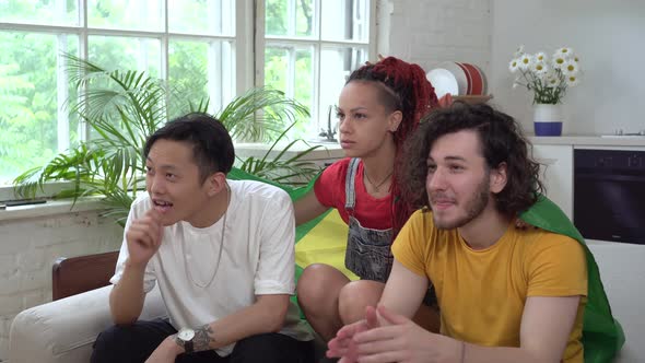 Brazilian Football Fans Watch TV at Home alt