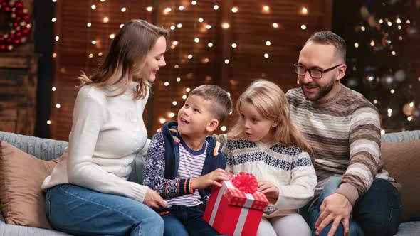 Kids and Parents Open Christmas Present Having Amazed Emotion alt
