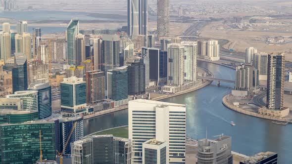Panoramic Aerial View of Business Bay Towers in Dubai at Evening Timelapse alt