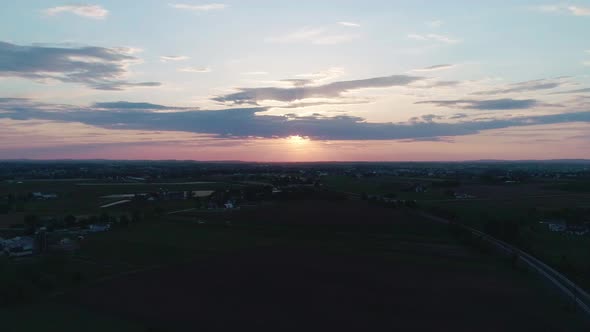 Aerial View of a Sunset Across Amish Farm Lands alt
