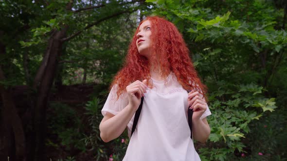 Woman in the Forest Looks Around alt