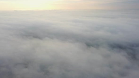 Landing a Drone That Flies Through the Clouds of the Morning Mist alt