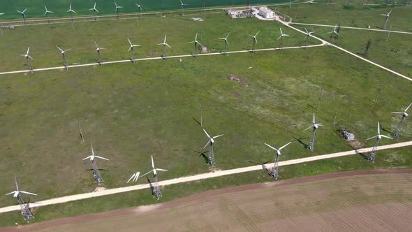 Video Quadcopter Running Wind Turbines Between Fields