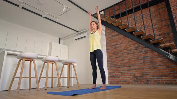 Cheerful Female Trains in Living Room alt