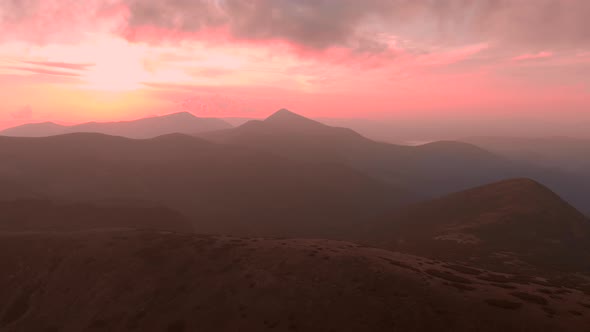 Scenic View of Majestic Red Sunset in Mountains alt