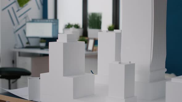 Close Up of Building Model and Maquette to Design Construction Plan on Desk alt