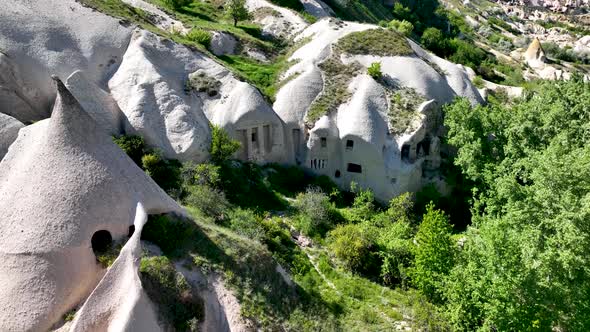 Awesome aerial view of rock formations called the Fairy Chimneys in Cappadocia 4 K alt