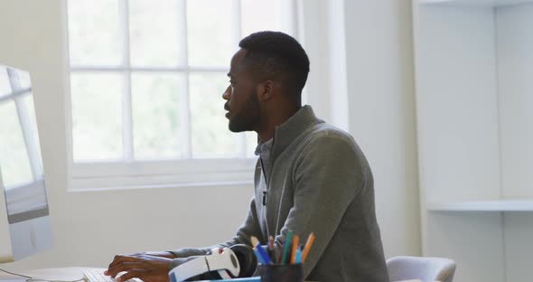 Young man working on computer alt