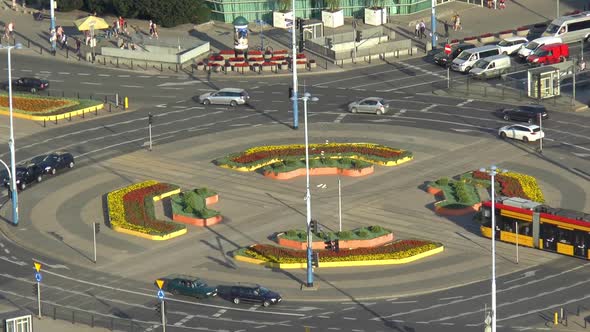City traffic at busy intersection in downtown Warsaw, Poland.