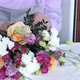 Close up florist hands working in flower shop studio. Floristry creating flower arrangement. - VideoHive Item for Sale