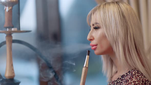Closeup Face of Glamour Girl Enjoying Blowing Dense Shisha Aroma at Hookah Bar alt