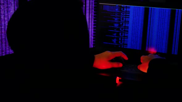 Human Hacker Is Involved In Breaking Into Security Systems. Cracks The Codes. alt