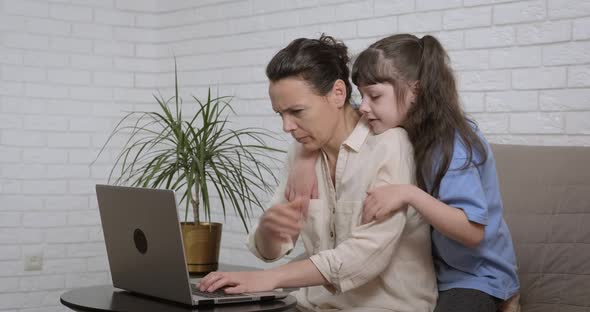 Remote mother work with child.  alt