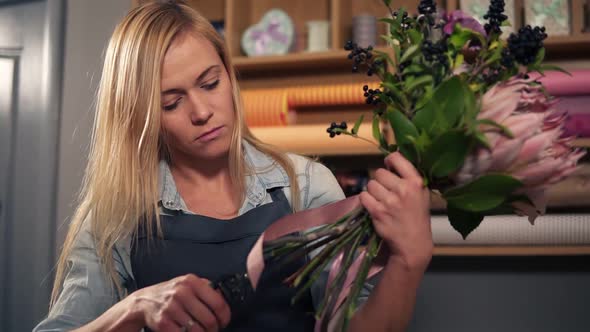 Female Blonde Florist Arranging Modern Bouquet alt