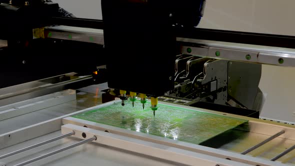 SMT Pick and Place Machine Installing SMD Electronic Components at Factory alt