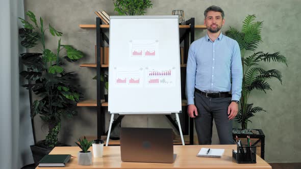 Smiling business man teacher greets listens student question remote video call alt