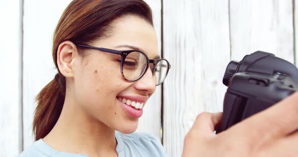 Photographer taking photo with vintage camera alt