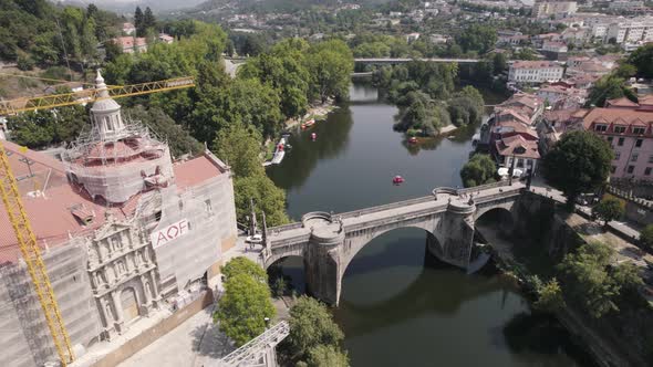 Church and Sao Goncalo Bridge over the Tamega River, Amarante, Portugal. Aerial view alt