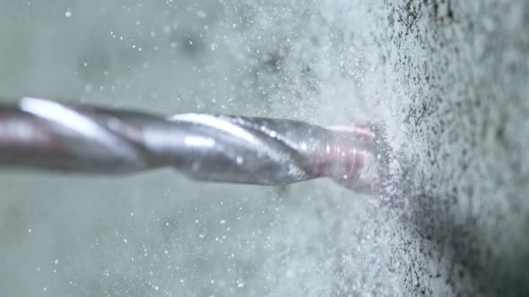 Super Slow Motion Detail Shot of Drilling Concrete at 1000 Fps alt