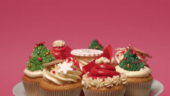 Christmas Cupcakes on Pink Background