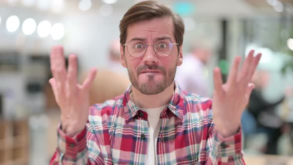 Portrait of Disappointed Male Designer Reacting To Loss, Failure alt