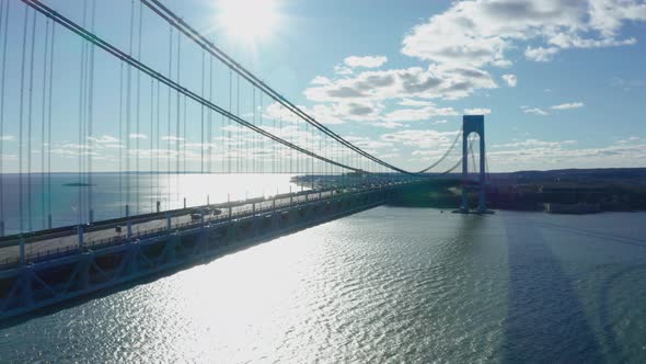 Aerial Drone Shot Flying Next to Deck of the Verrazano Bridge in New York City alt