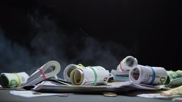 Money on Table Closeup Cash Illuminated with Light alt