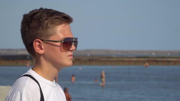 Portrait of a Teenager in Sunglasses.